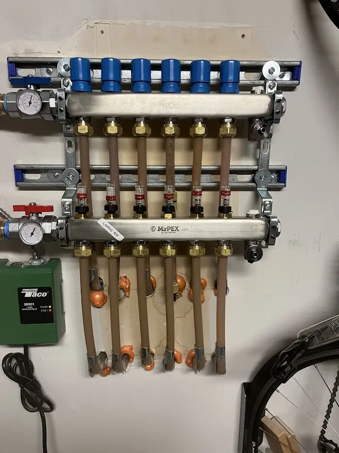 Plumber performing Water Heater Repair at a residential property in Flower Hill